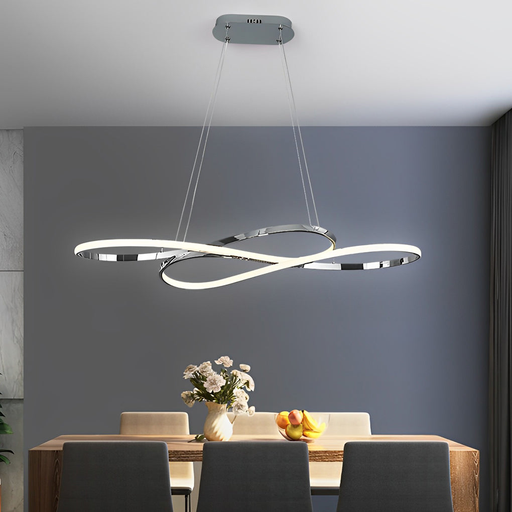 LED infinity chandelier with sleek modern design hanging above dining table and chairs.