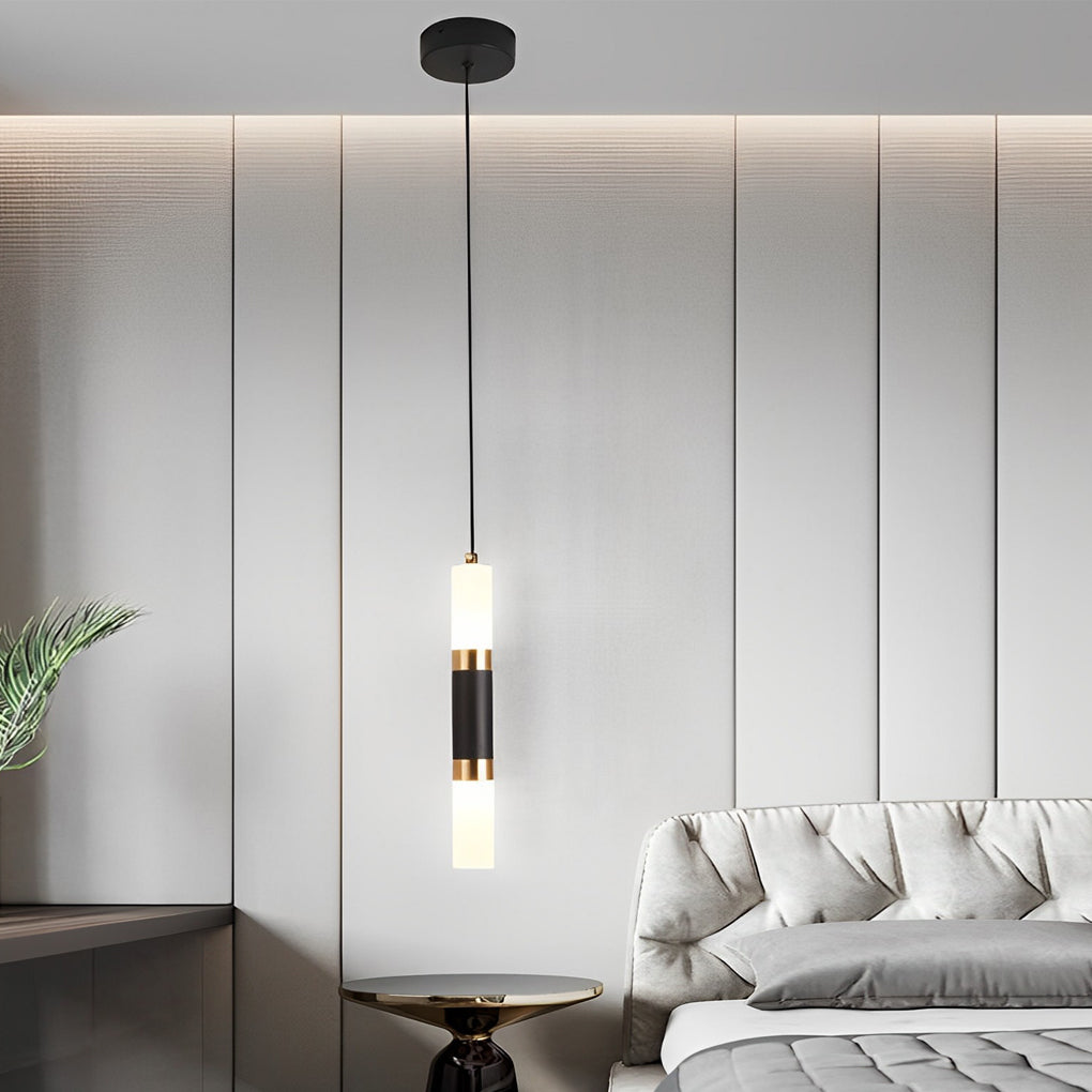 Sleek slim black LED cylinder pendant light with dual light sections over a modern bed frame.