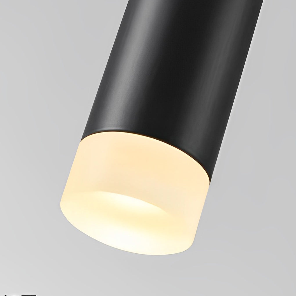 Macro of a Slim Black Pendant Light showing the warm light through a frosted acrylic tip.