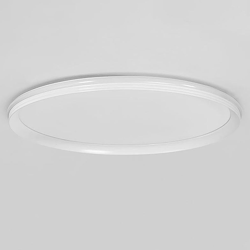 Slim ceiling light close-up showing low-profile surface mounted structure.