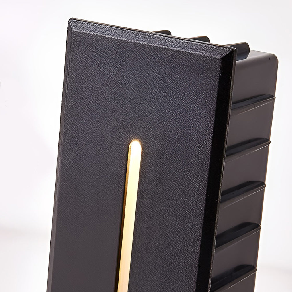 Slit stair lamp with close-up of its sleek design and light output.