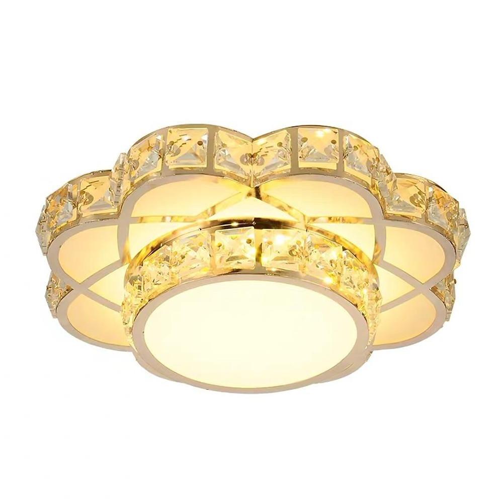 Close-up view of the metal frame and crystal accents of a flush mount ceiling light.