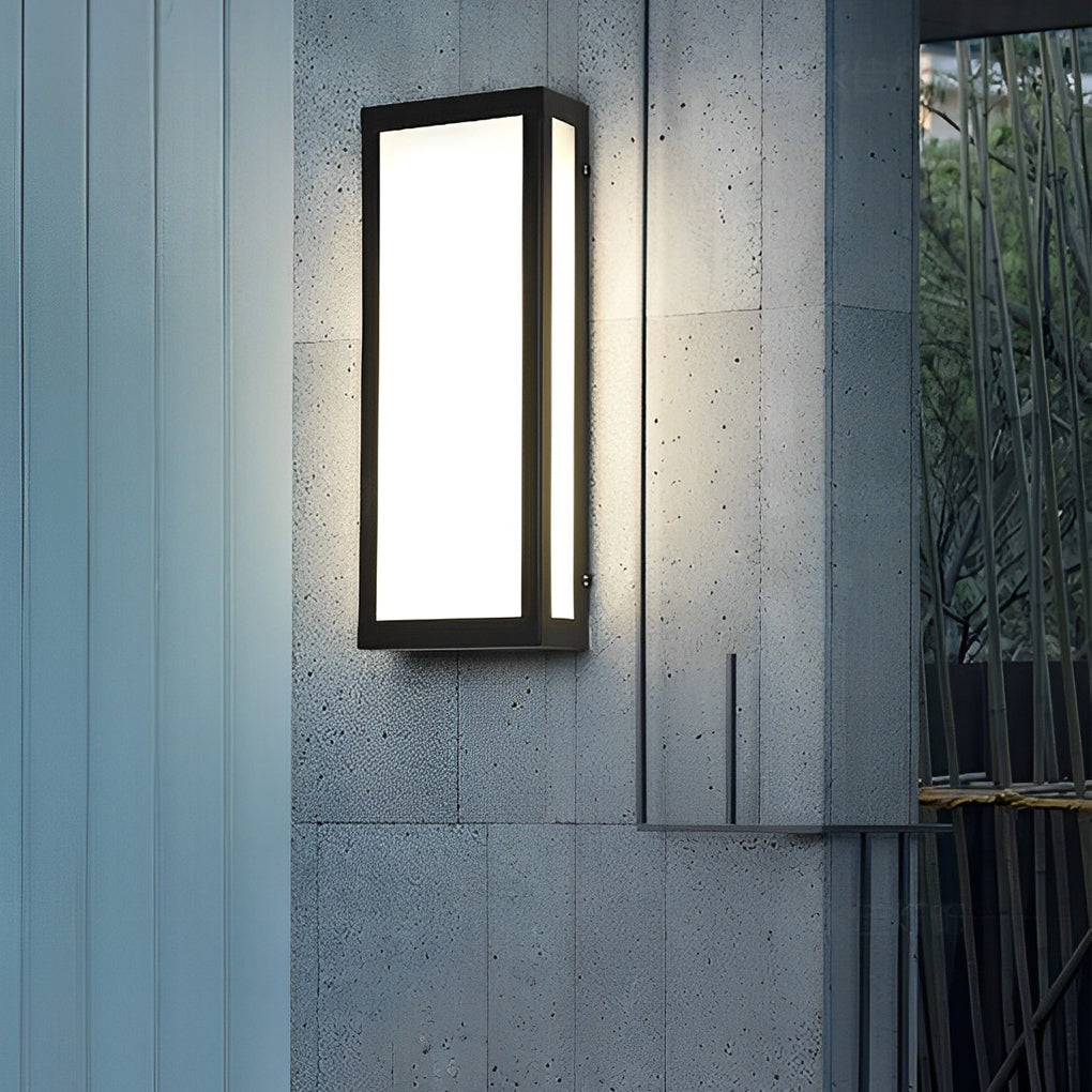 Rectangle outdoor wall lighting casting soft light on textured wall.