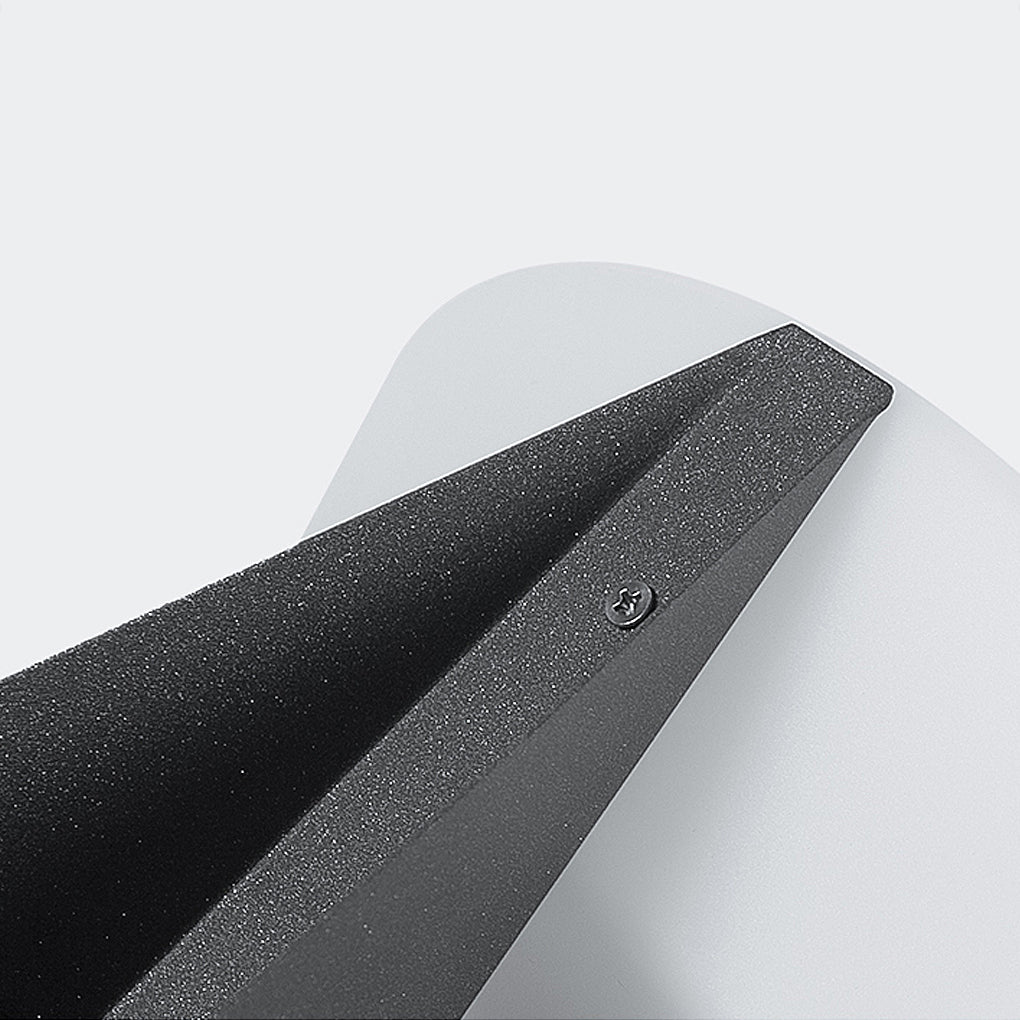 Solar fence pillar light close-up highlighting the textured metal housing and light diffuser.