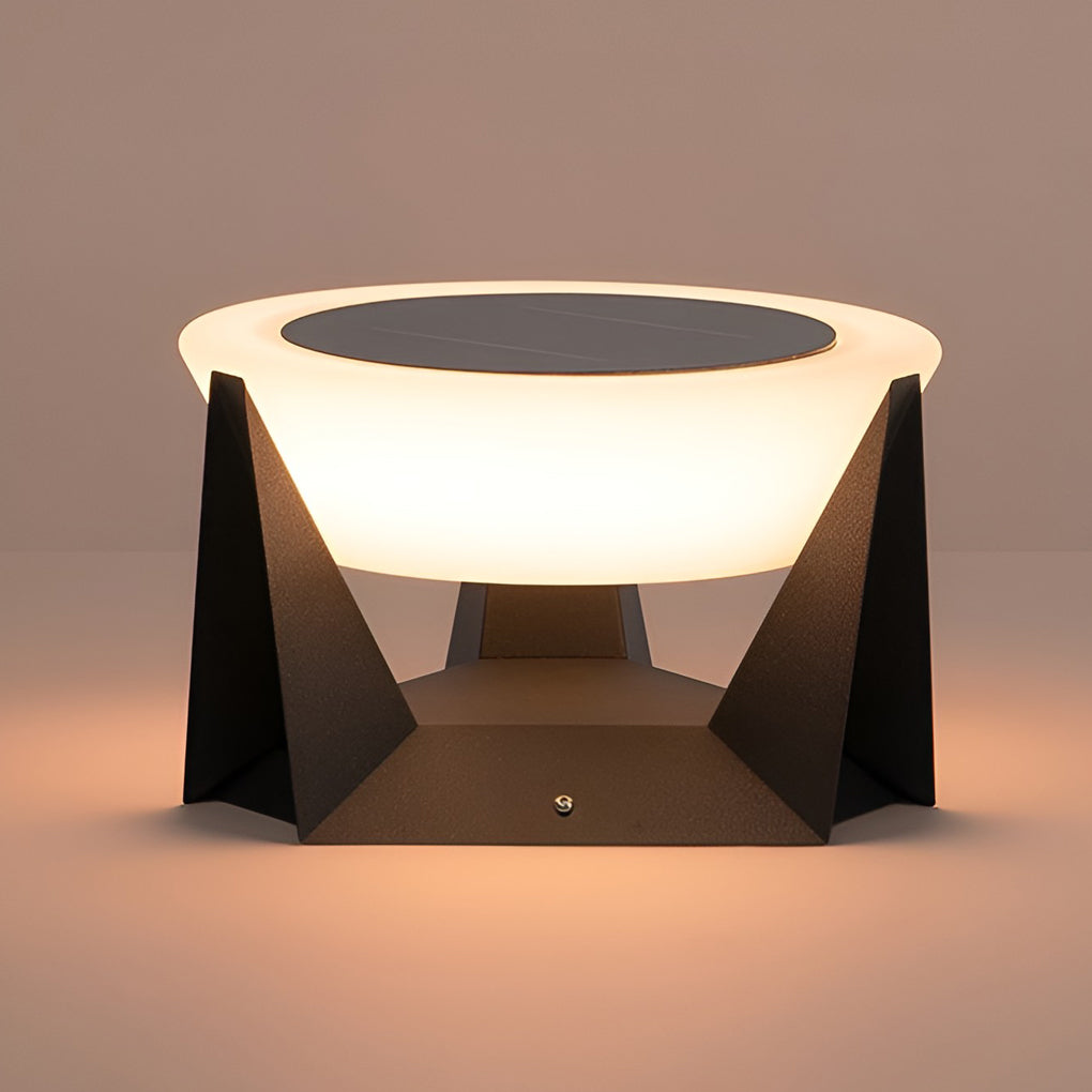 Solar fence pillar light illuminating a wooden deck area with modern outdoor furniture.