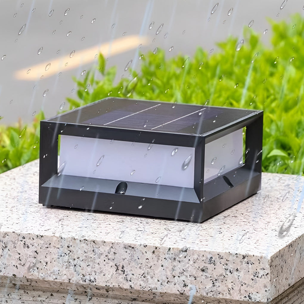 Solar garden pillar lights with black frame, providing soft light along garden fence.