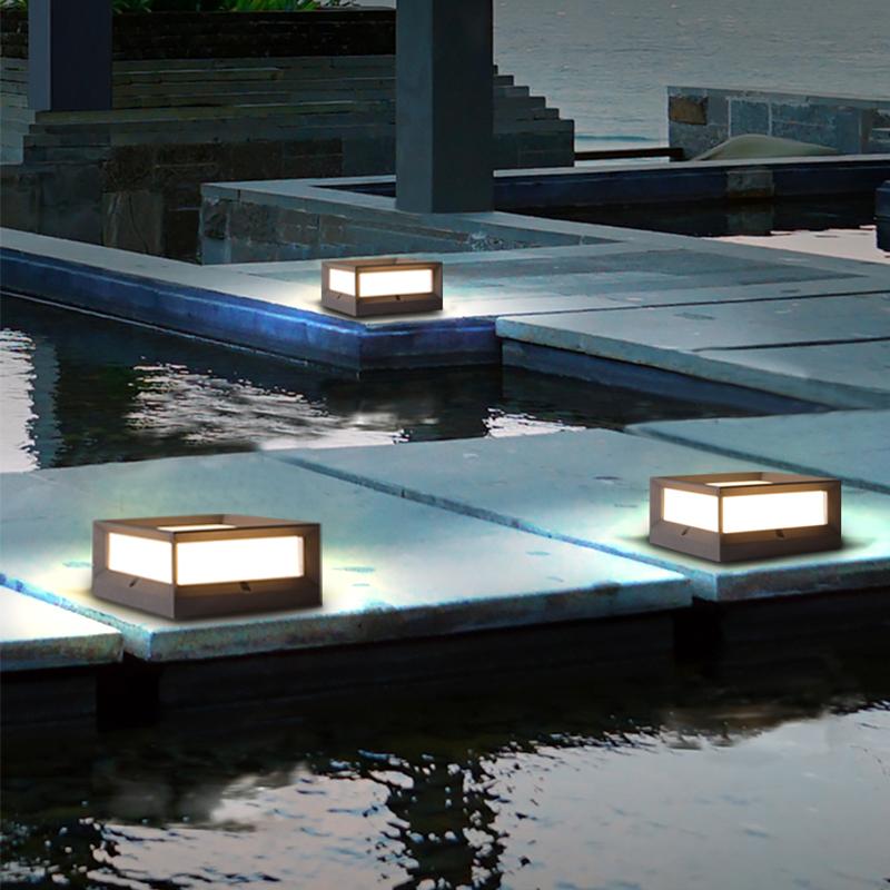 Solar garden pillar lights installed along garden steps, providing soft illumination at night.