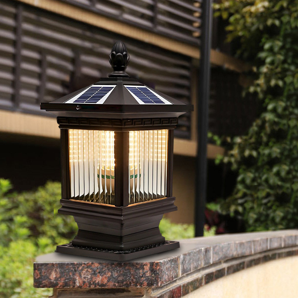 Solar garden post lights mounted on a brick wall, adding soft illumination to an outdoor landscape area.