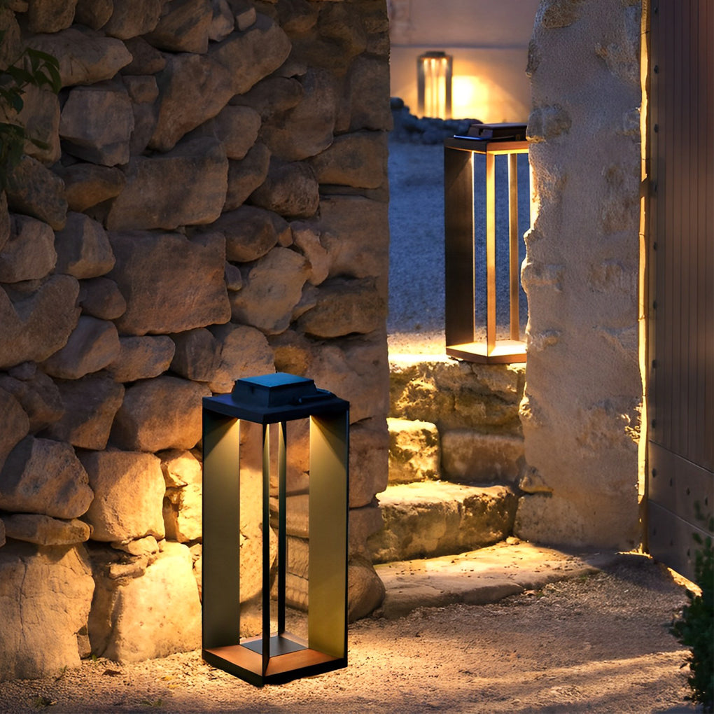 Portable solar lantern placed near stone steps and a textured exterior wall for pathway lighting.