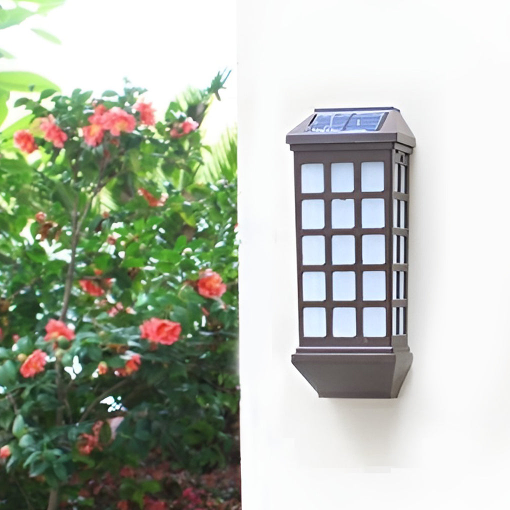 Solar light outdoor wall installed near flowering plants, blending lighting with outdoor landscaping.