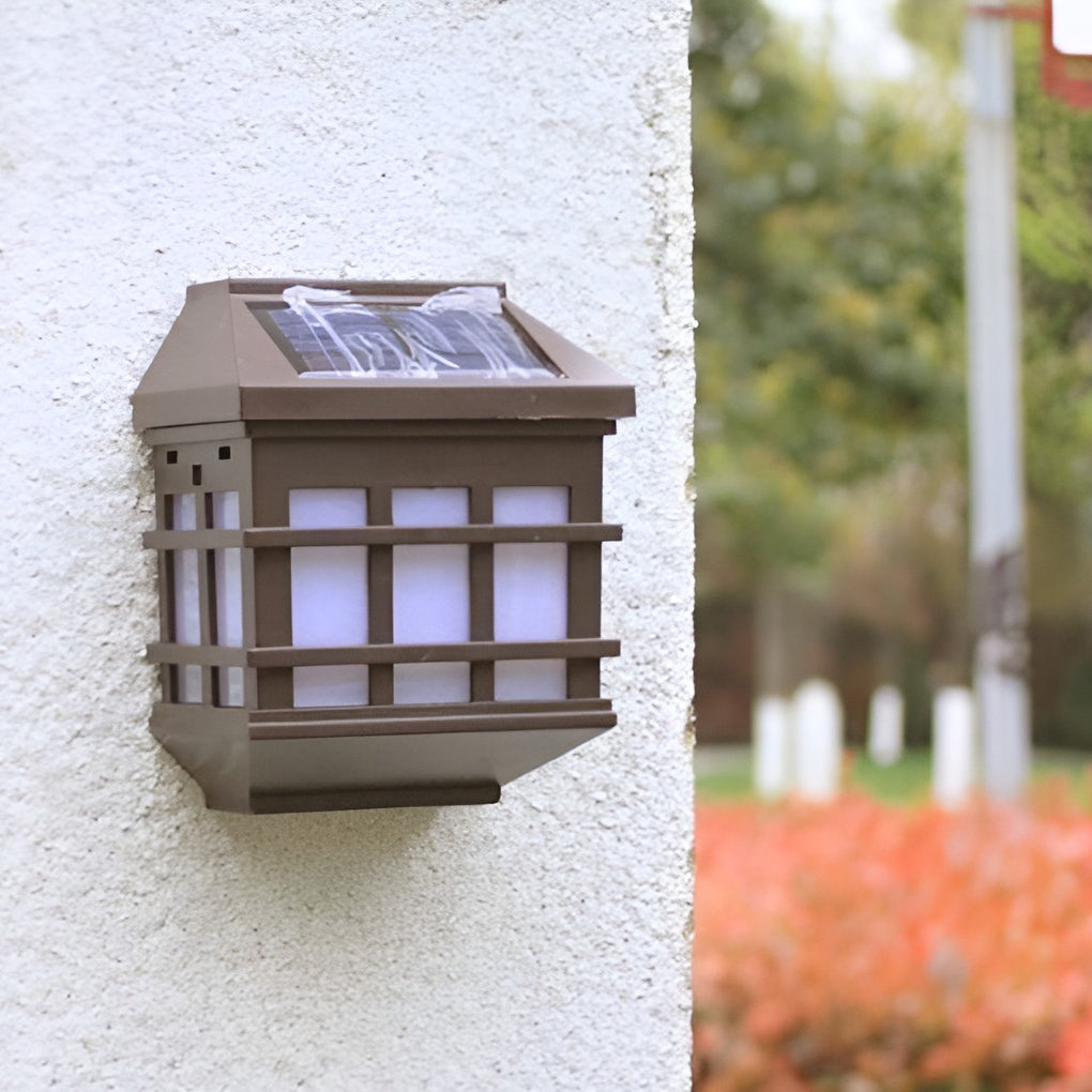 Solar light outdoor wall mounted on a stucco surface, showing compact lantern-style design.