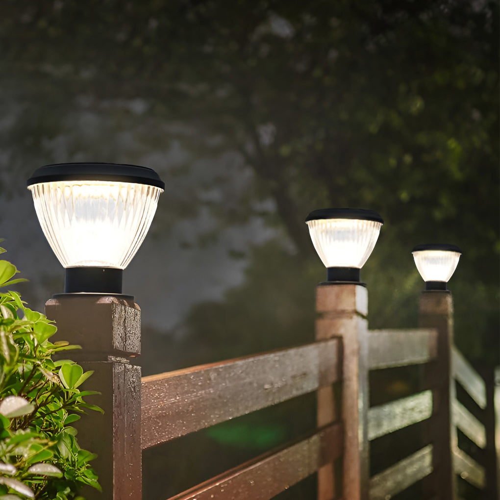 Solar light post cap providing elegant illumination for a lakeside deck.