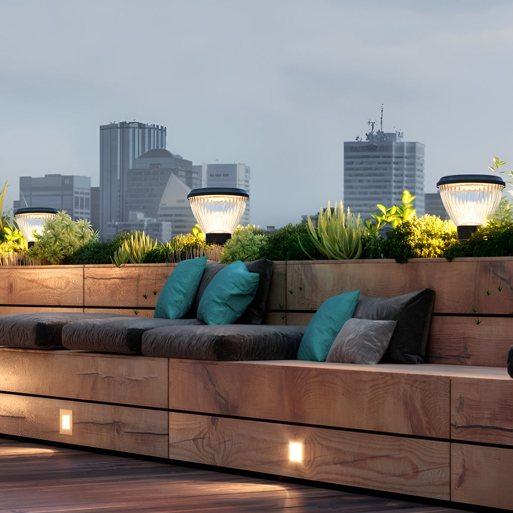 Solar light post cap enhancing a modern rooftop terrace with warm light.