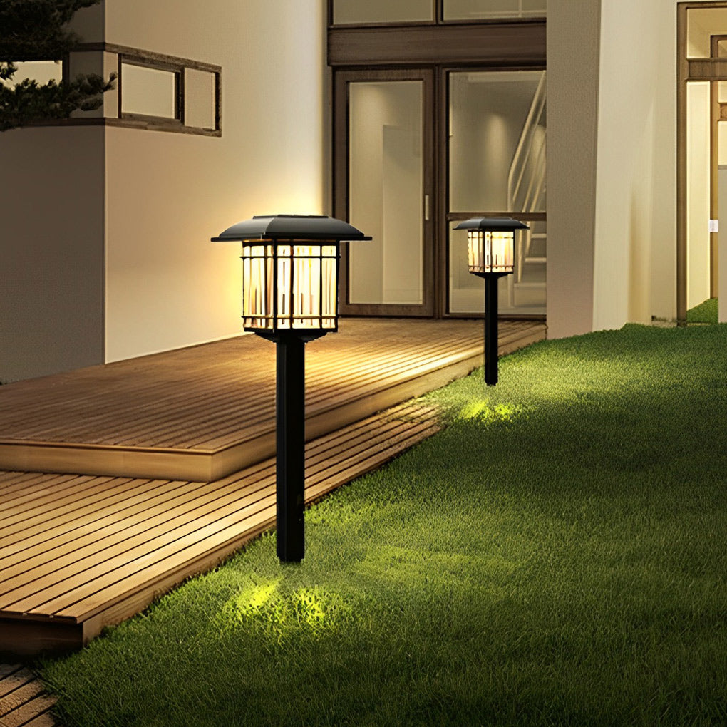 Solar outdoor lawn light with a minimalist design, installed in a vibrant garden.