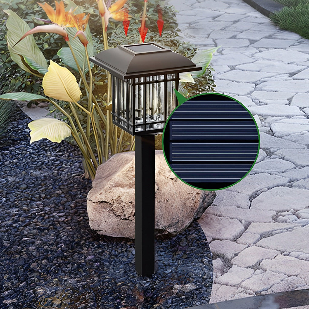 Solar outdoor lawn light with a sleek design, illuminating a stone pathway at night.