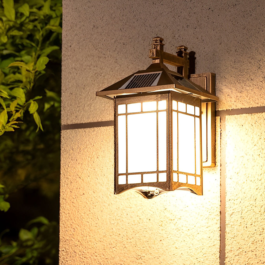 Lantern wall sconce with solar panel on top for eco-friendly outdoor lighting solution.