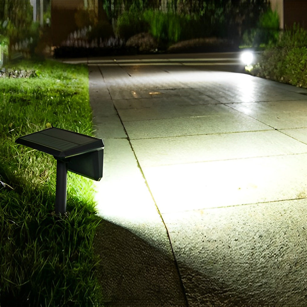 Solar path lights outdoor casting a soft glow on a curved garden path, creating a serene atmosphere.