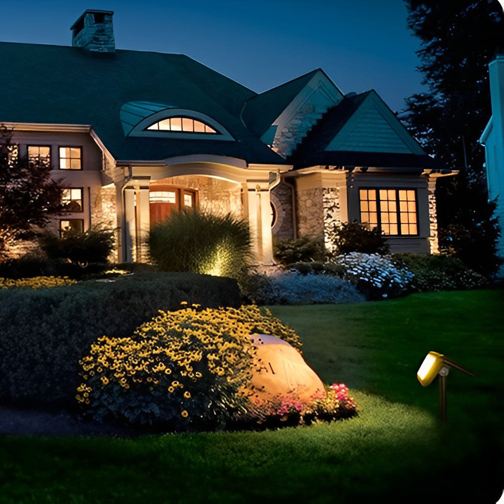 Solar path lights outdoor illuminating a residential driveway, enhancing curb appeal and safety.
