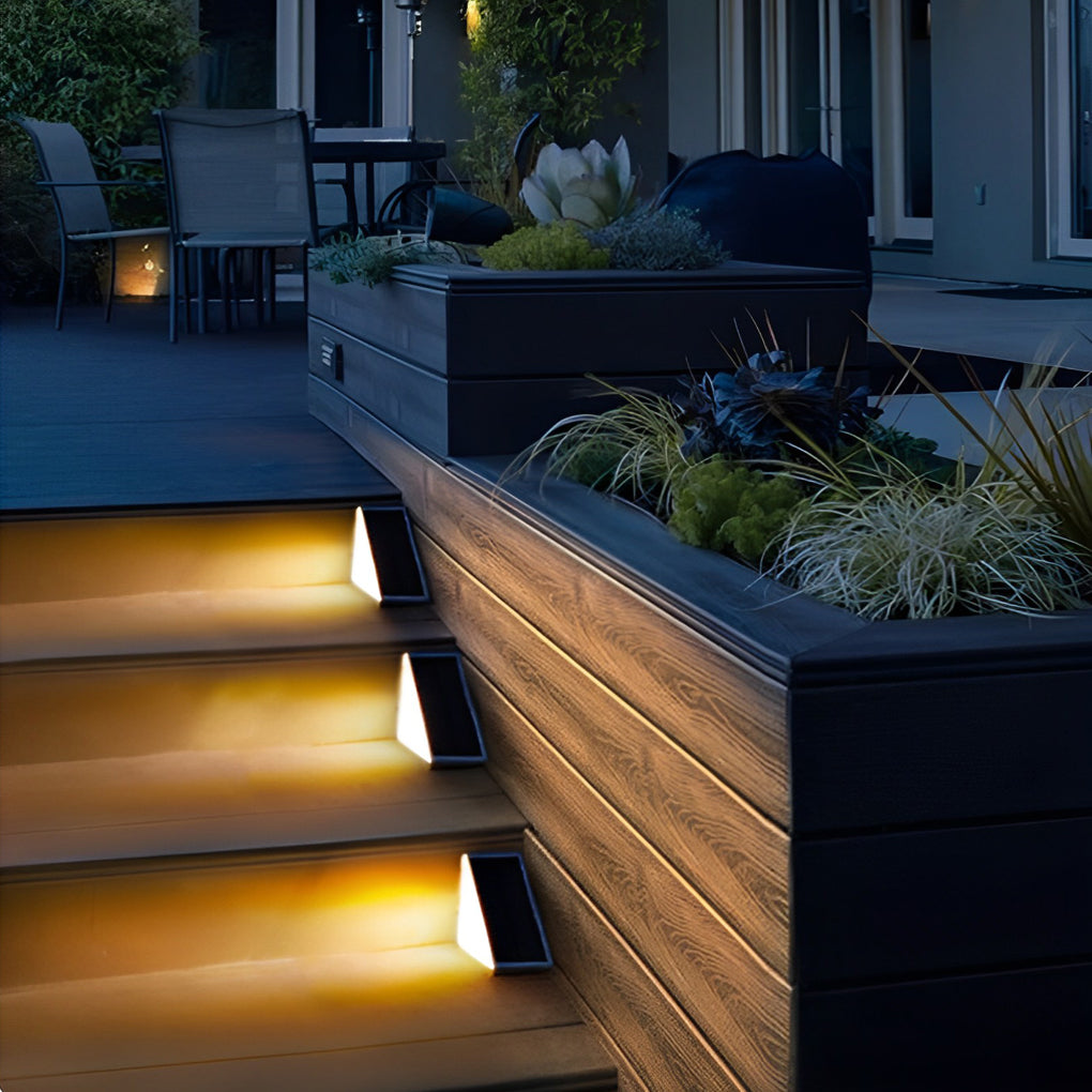 Solar powered lights for steps integrated into a patio staircase, creating a welcoming and elegant outdoor ambiance.