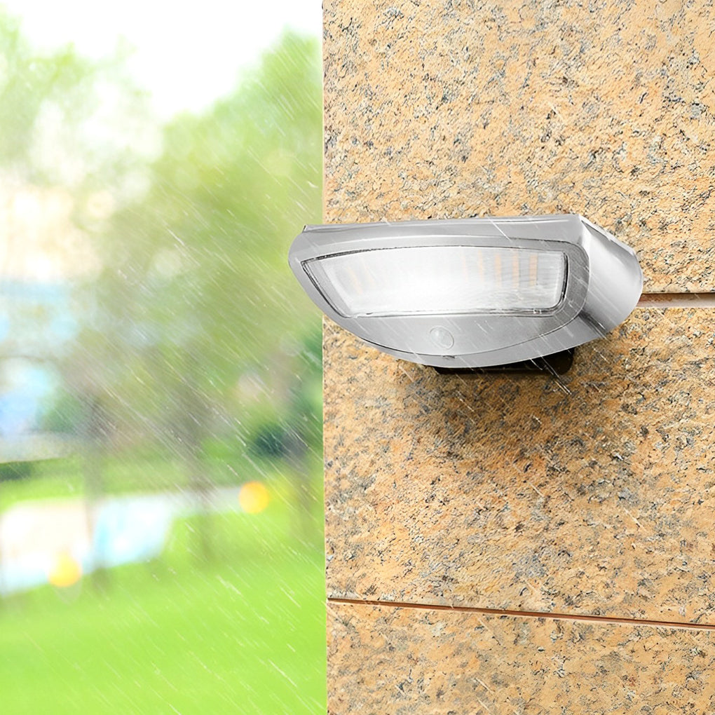 Solar powered motion sensor wall light with a detailed view of its motion sensor.