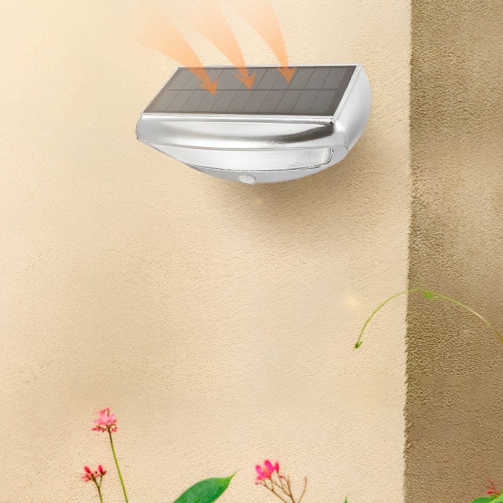 Solar powered motion sensor wall light with a sleek black finish, mounted on a wall.