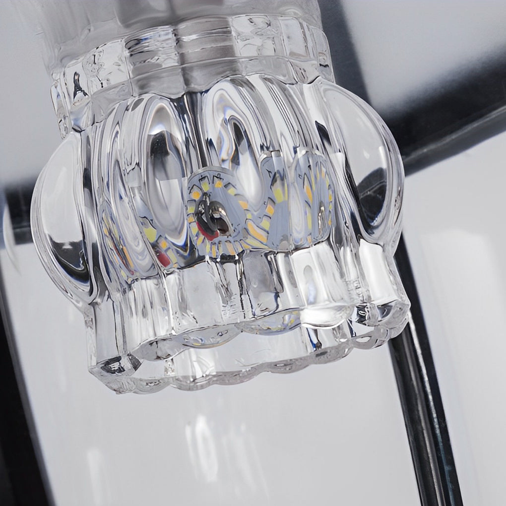 Solar powered pillar lights with a close-up of the illuminated glass panels.