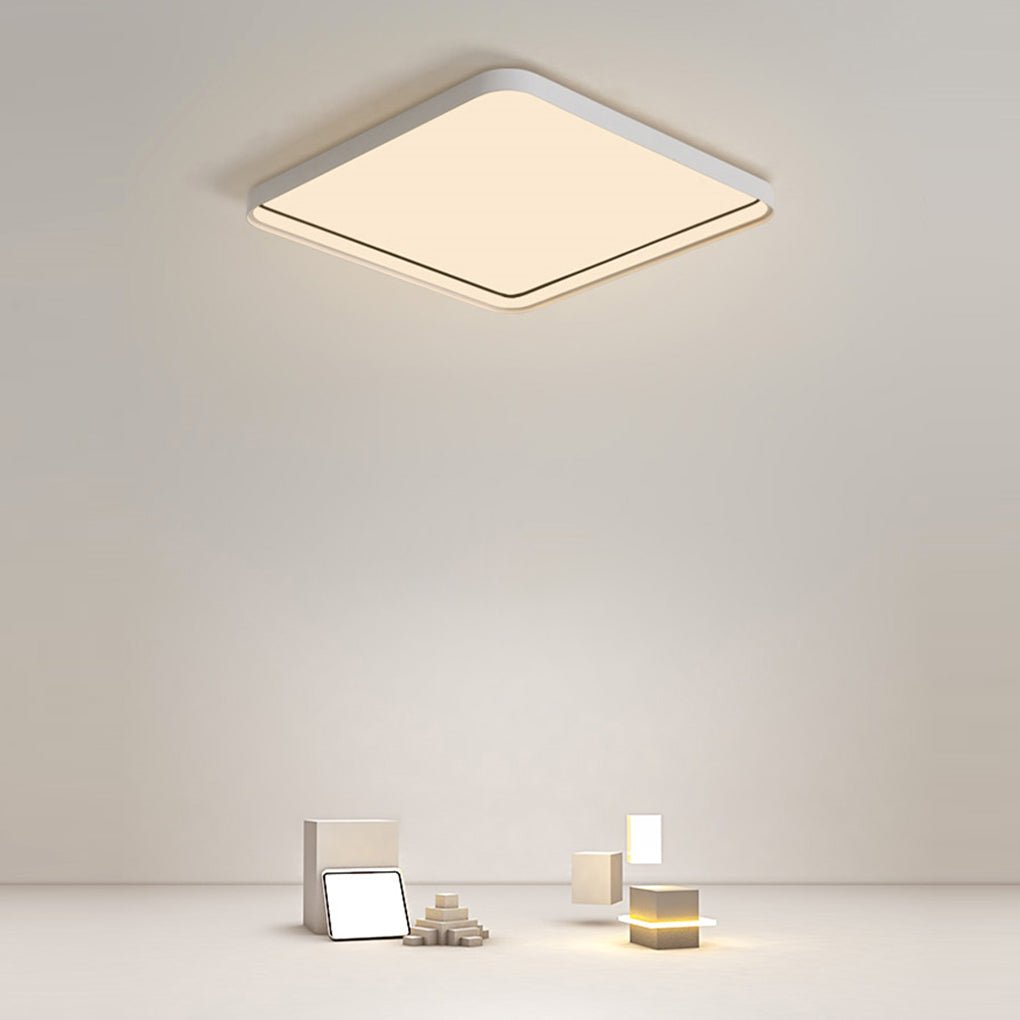 Square flush mount ceiling light product display in minimalist studio setting.