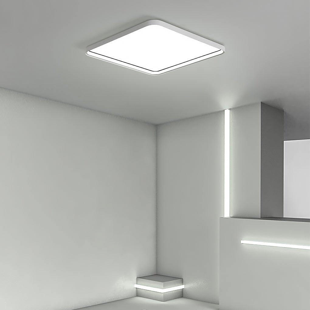 Square flush mount ceiling light installed in a modern architectural interior.