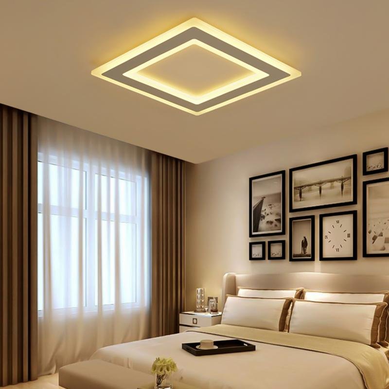 Square flush mount light with a minimalist design, mounted on a white ceiling.