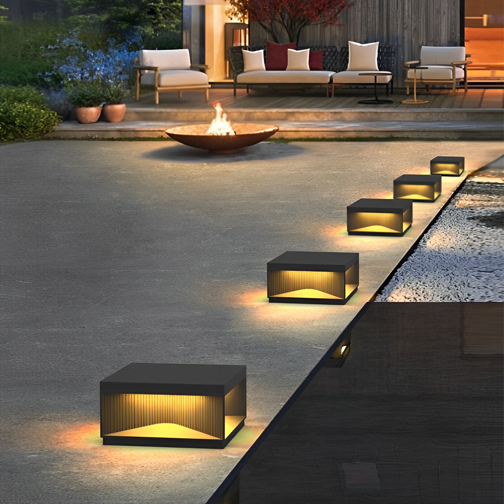 Square outdoor pillar lights product image with modern box design illuminated from below.