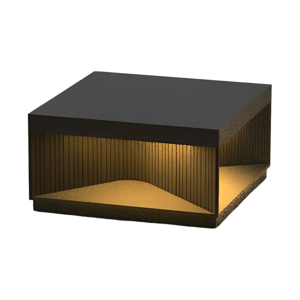 Square outdoor pillar lights arranged along poolside walkway creating warm linear lighting effect.