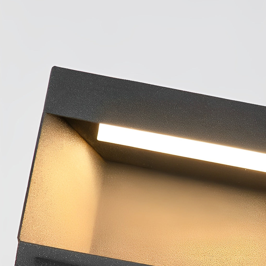 Angled close-up view of square solar deck lights highlighting LED strip and downward light output.