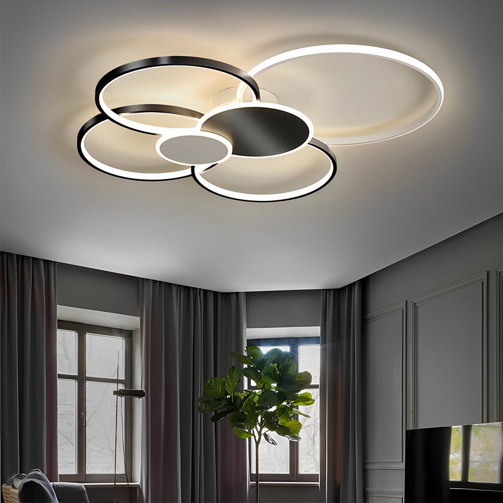 Stacked ring ceiling light featuring black and white rings in a contemporary interior.
