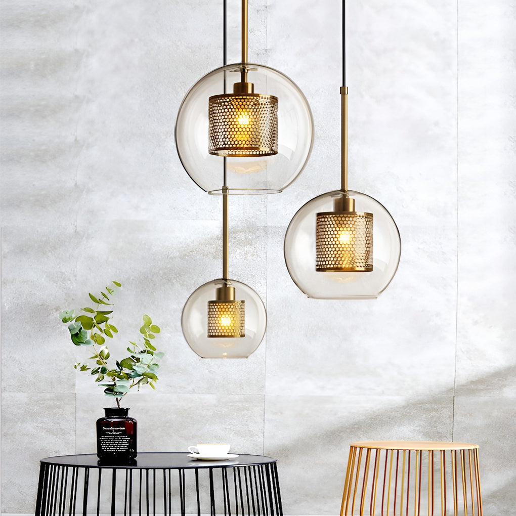 Cluster of Clear Glass Globe Pendant fixtures at staggered heights in a modern grey interior.