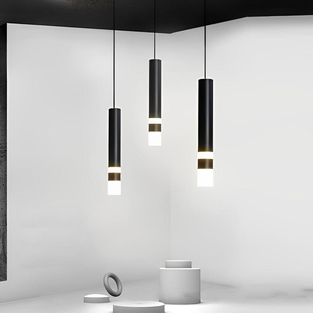 Staggered trio of modern Black LED Cylinder Pendant lights in a minimalist grey art gallery setup.