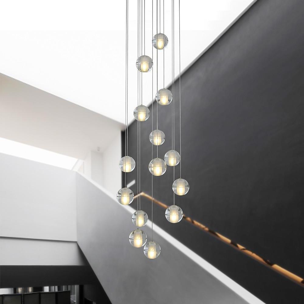 Staircase hanging chandelier enhancing a contemporary staircase with sleek, spherical design.