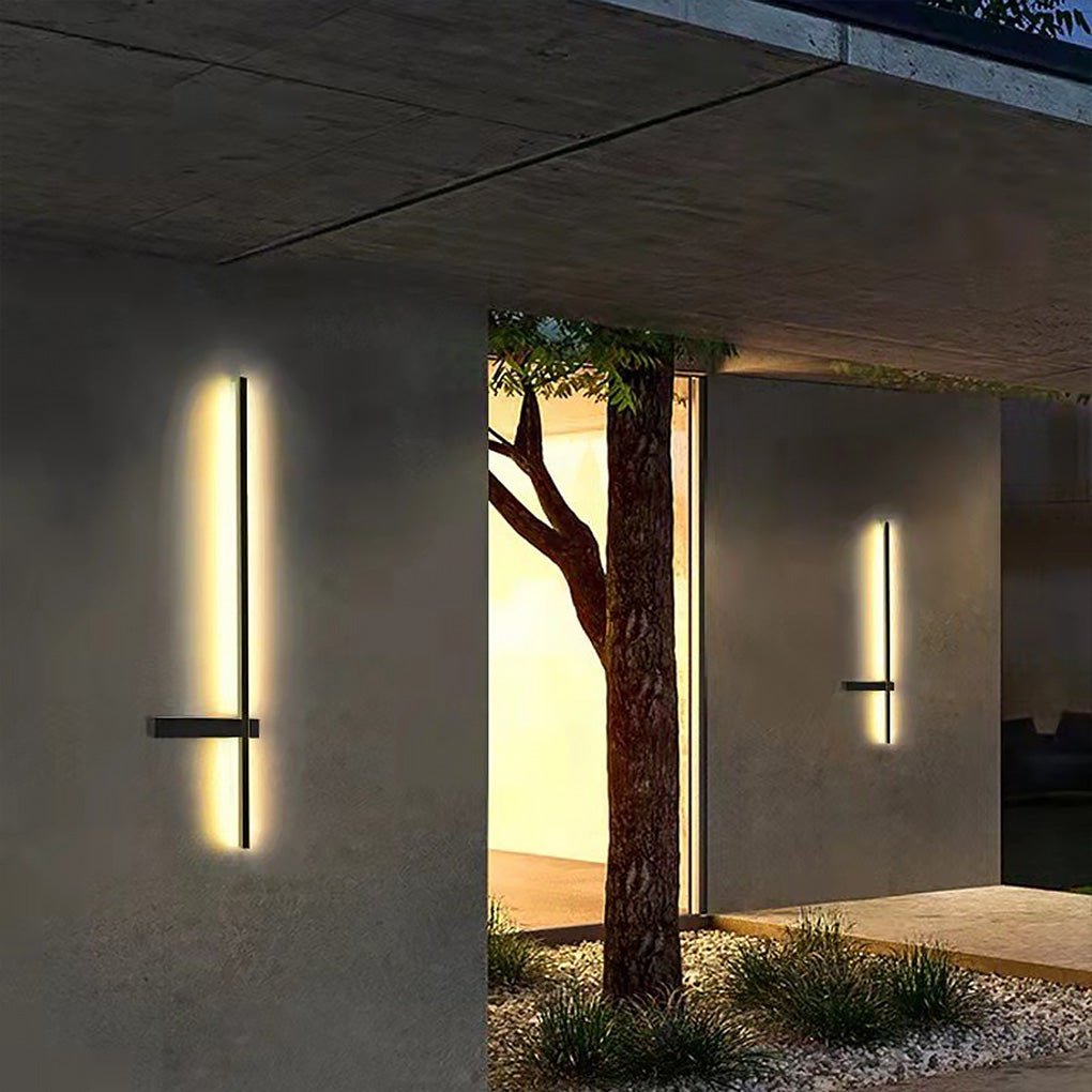 Contemporary Strip Wall Lighting mounted on a covered outdoor corridor wall, highlighting a slim vertical profile with soft ambient illumination.
