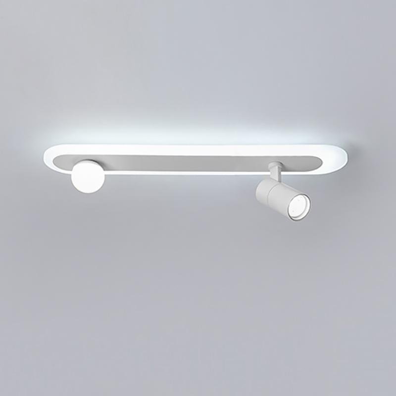 Surface mounted spotlights with linear base in a modern interior ceiling.