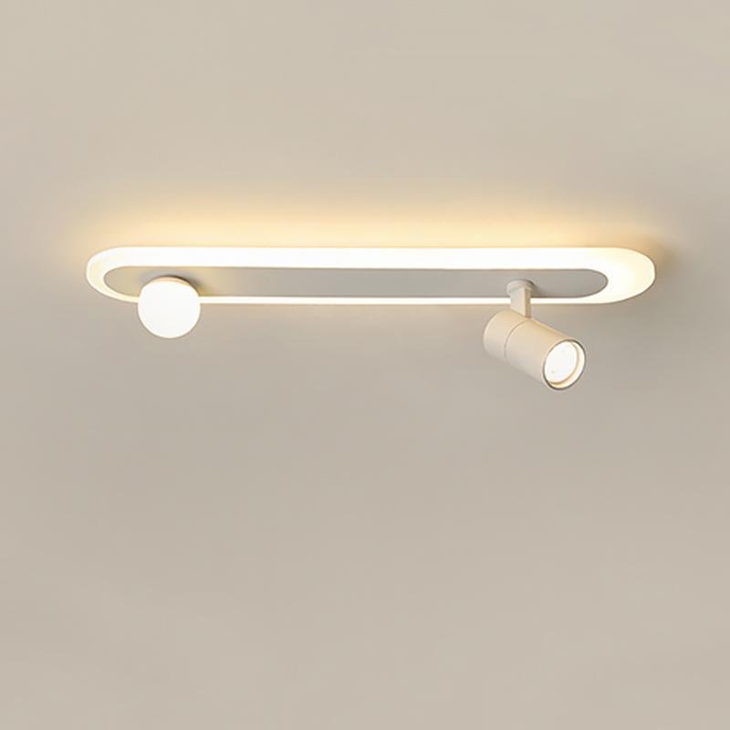 Surface mounted spotlights with warm lighting mounted on ceiling surface.