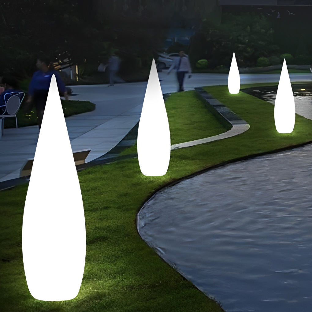 Teardrop shaped outdoor light with soft white glow for pathway decoration.