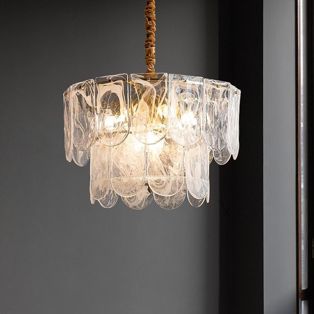 Stunning glass drum chandelier with tiered vertical crystal prisms and a warm gold finish, hanging.