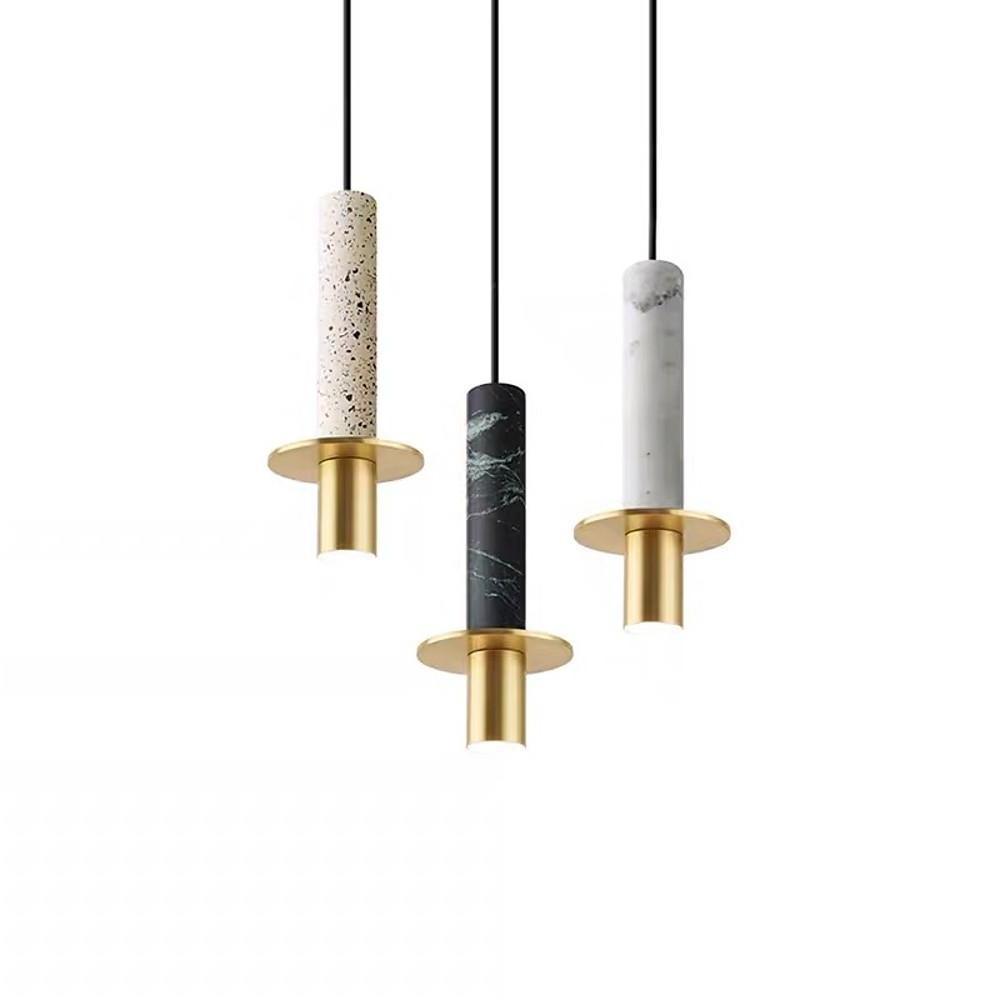 Trio of mixed marble and terrazzo alabaster mini pendant lights staggered over a white background.