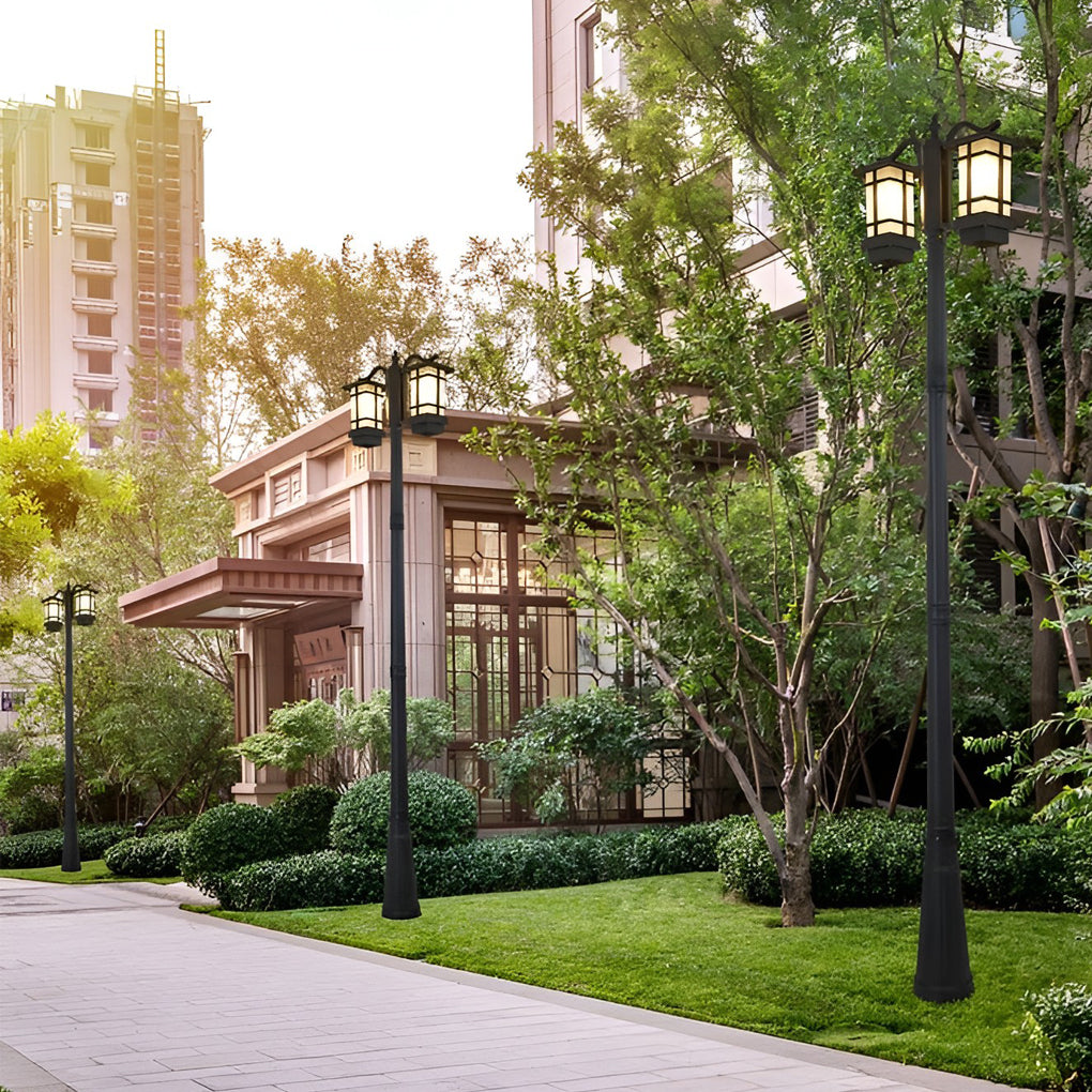 2 head outdoor post light illuminating pathway near residential area.