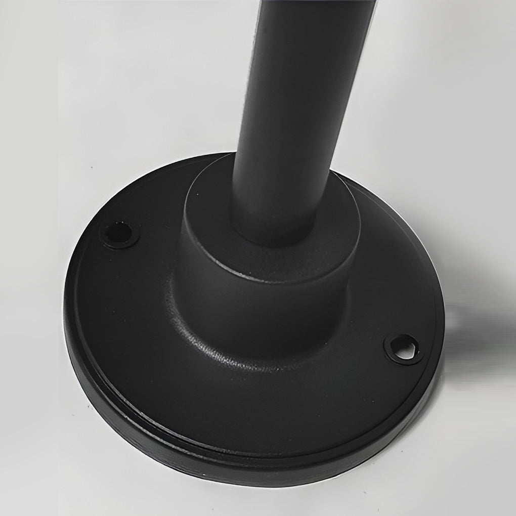 Umbrella path lamp with detailed view of its base and installation.