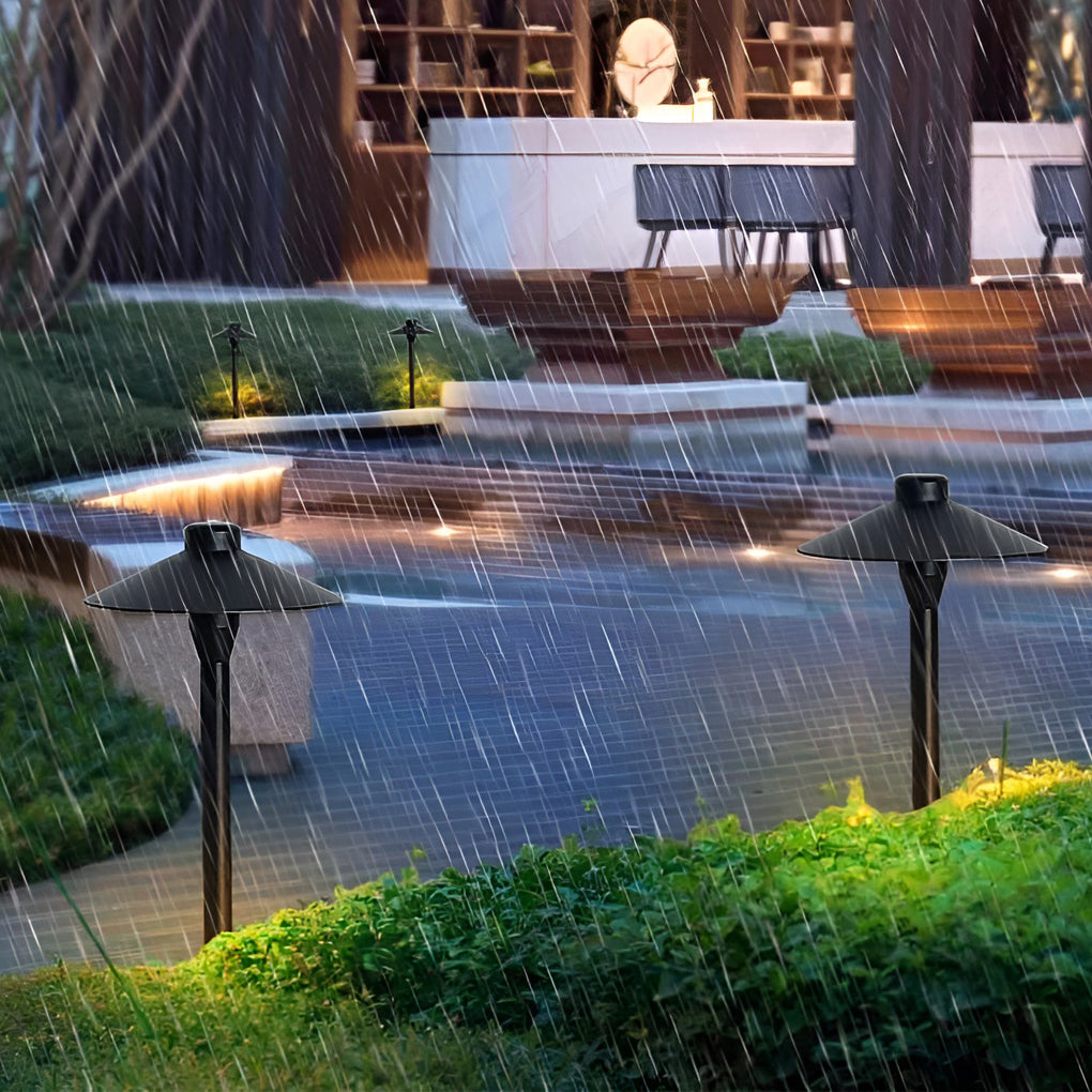 Umbrella path lamp providing elegant illumination for a contemporary garden.