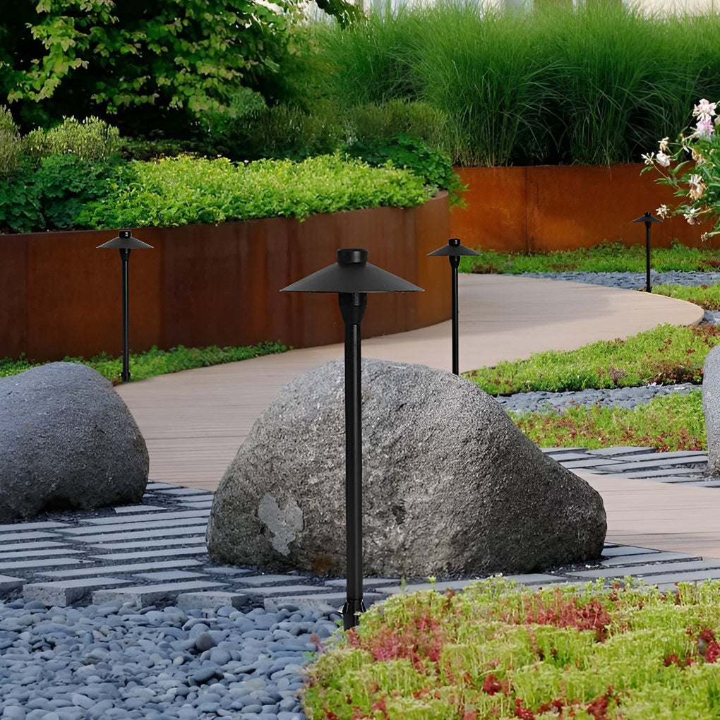 Umbrella path lamp illuminating a cozy outdoor deck with directional glow.