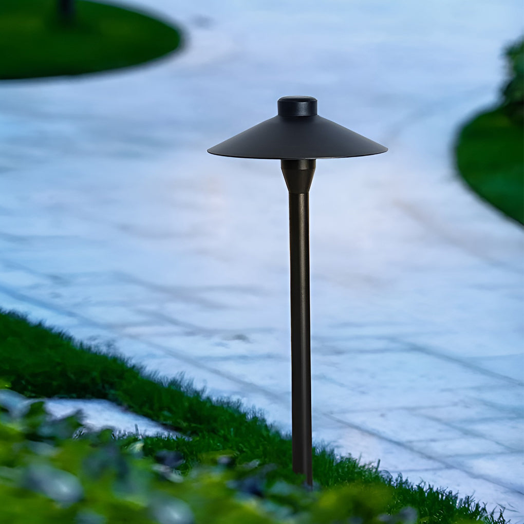 Umbrella path lamp providing soft illumination along a stylish garden pathway.