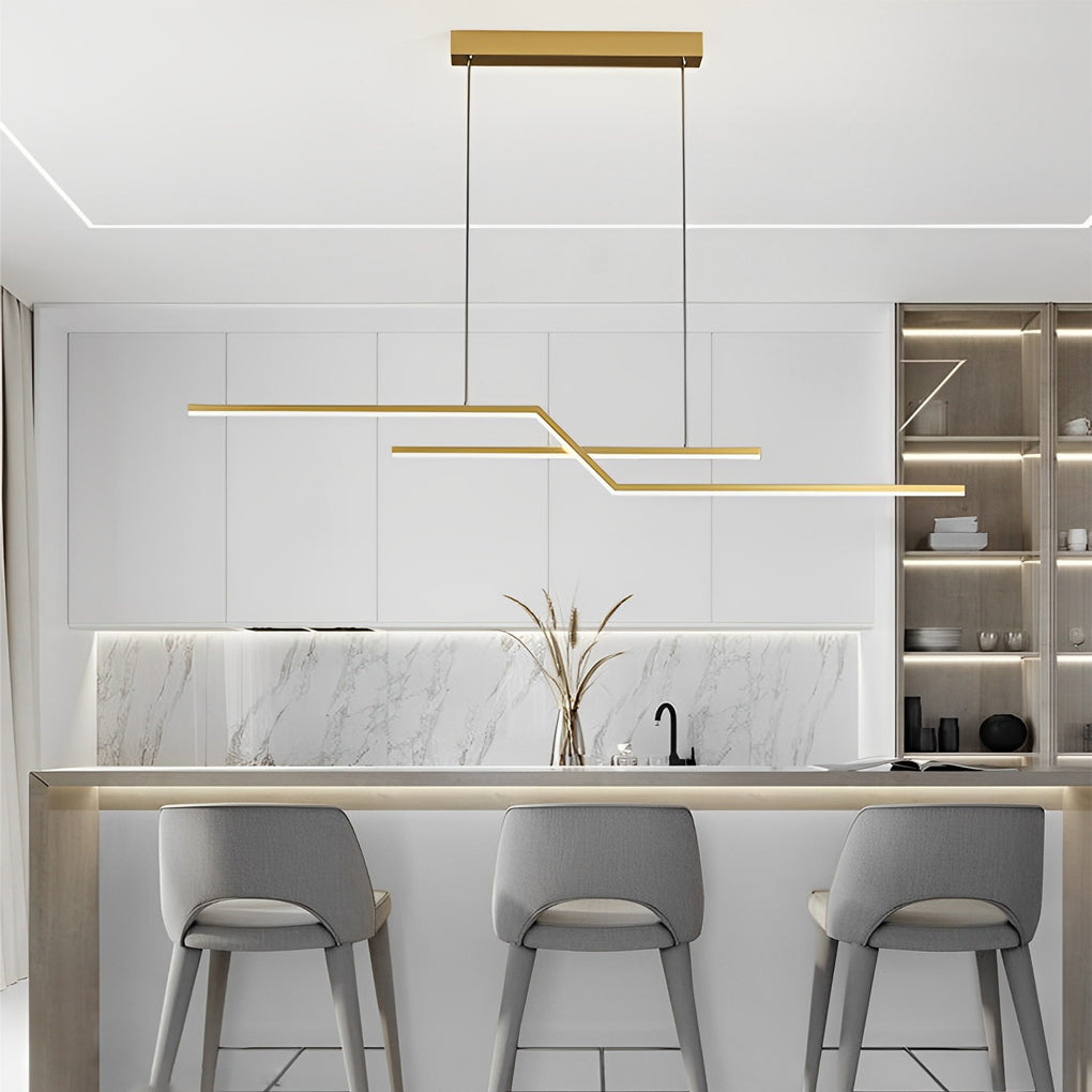 Unique pendant lighting with a gold finish displayed over a marble kitchen island, enhancing modern luxury interiors.