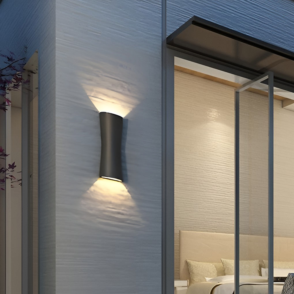 Up and down exterior wall lights installed around a garden feature wall for landscape lighting.