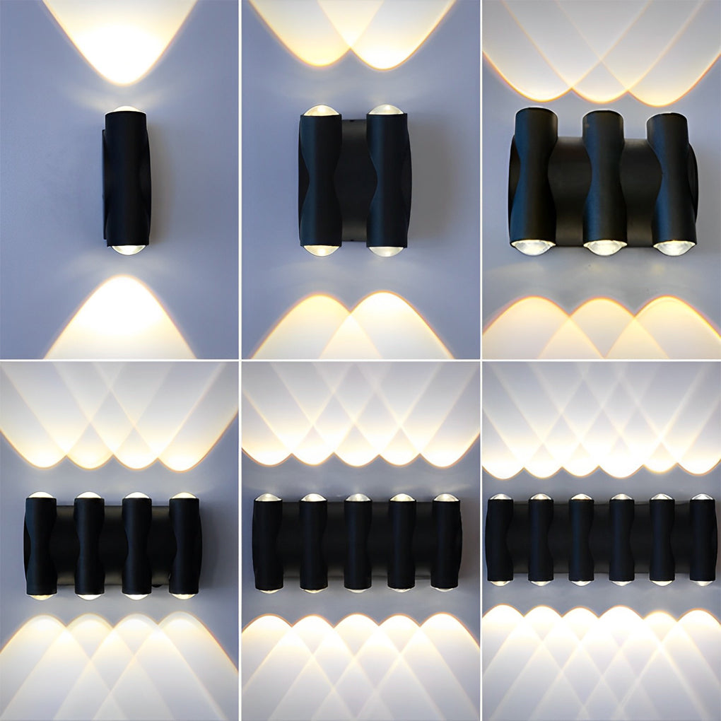 Up and down light wall sconce with black finish enhancing a modern exterior.